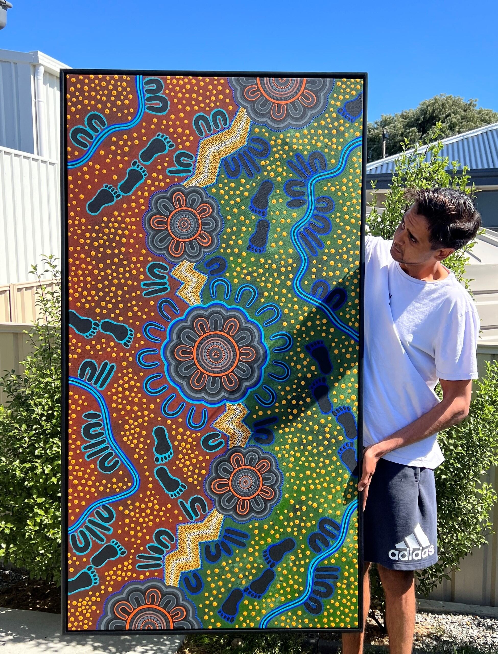 Artist Preston Warren with the artwork he created for SA Power Networks Reconciliation Action Plan (RAP).